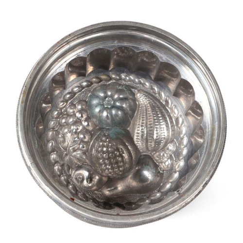 219 - A Victorian pewter ice cream or blancmange mould, No. 1, with registration lozenge mark, 17cms diame... 