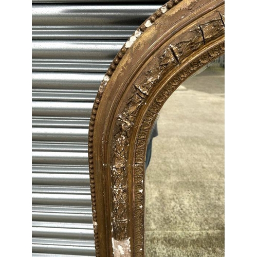 2190 - A large Victorian arch topped giltwood and gesso overmantle mirror with original ceramic bun feet an... 