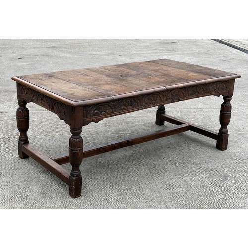 2199 - A large 17th century style oak refectory table with carved frieze, on turned bulbous carved legs joi... 