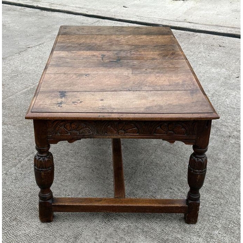 2199 - A large 17th century style oak refectory table with carved frieze, on turned bulbous carved legs joi... 