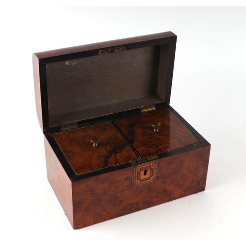 224 - A Victorian figured walnut two-division tea caddy, 26cms wide.