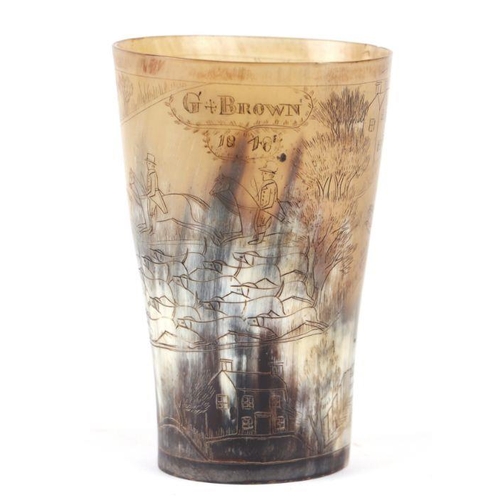 232 - A horn beaker decorated with a fox hunting scene, 14cms high.