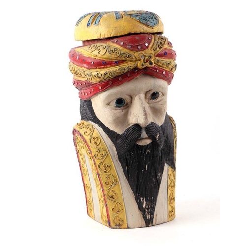 244 - A carved and polychromed wooden box and cover in the form of a bearded Turkish man, 34cms high.