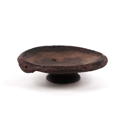 245 - A pottery pedestal dish, 18.5cms diameter, possibly iron age.