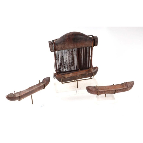 246 - A 19th century wooden hand loom and shuttles, mounted on Perspex display stands, ex Andrew Crawforth... 