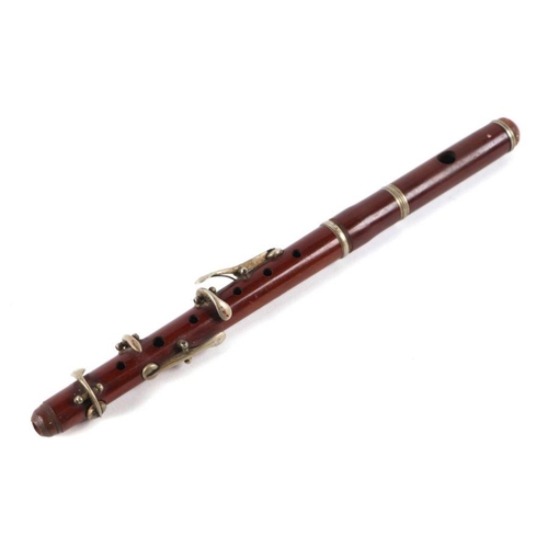25 - A three-piece mahogany piccolo, 30cms long