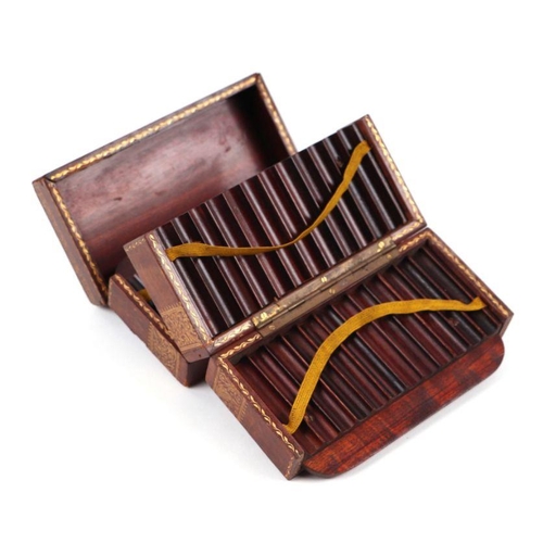 273 - A tooled leather cigarette box with fitted interior, 14cms wide.