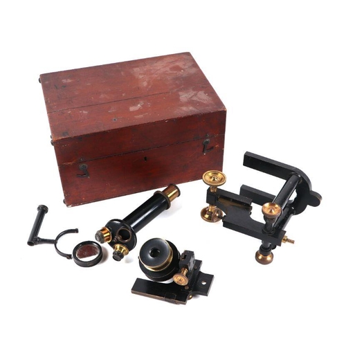 281 - A black lacquer and brass microscope with a selection of lenses, cased.