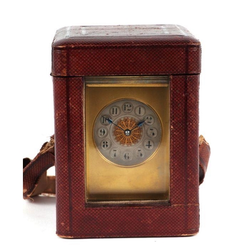 293 - A brass cased carriage clock, the silvered dial with Arabic numerals, the movement striking on a gon... 