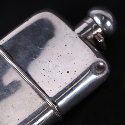 337 - A silver plated hip flask, 9cms wide.