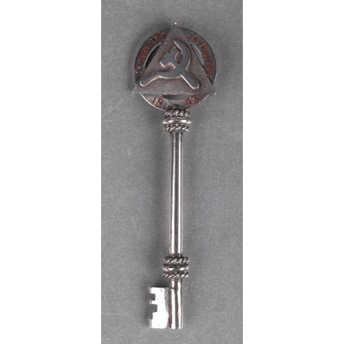 376 - A Masonic or society white metal presentation key presented to 'JAV Rowe' and dated 1942, 11.5cms lo... 