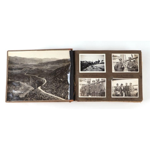 49 - A post and WWII black and white photograph album of a Middle East military tour, to include images o... 