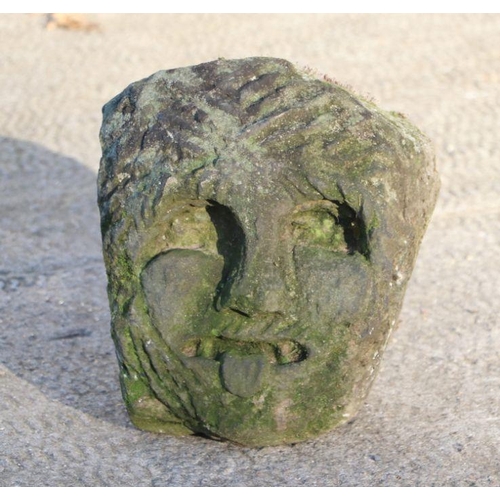 6 - A carved limestone head of a Knights Templar / Green man gargoyle depicted with chain mail cowl and ... 