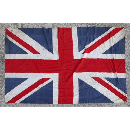 67 - Two early 20th century printed linen Union Jack flags. The largest is approximately 174cms (68.5ins)... 