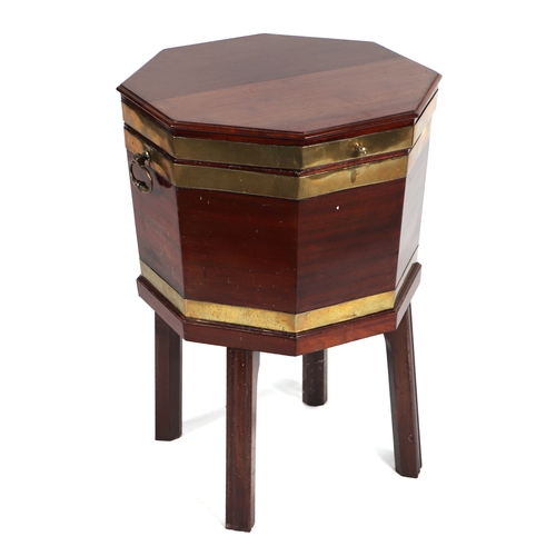 2200 - A 19th century octagonal form mahogany cellarette with brass banding and carry handles, on tapering ... 