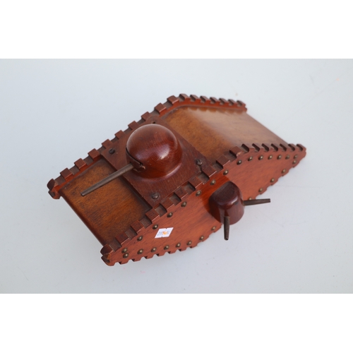 92 - A large wooden trench art money box in the form of a WWI tank, approx 26cms long and other items of ... 