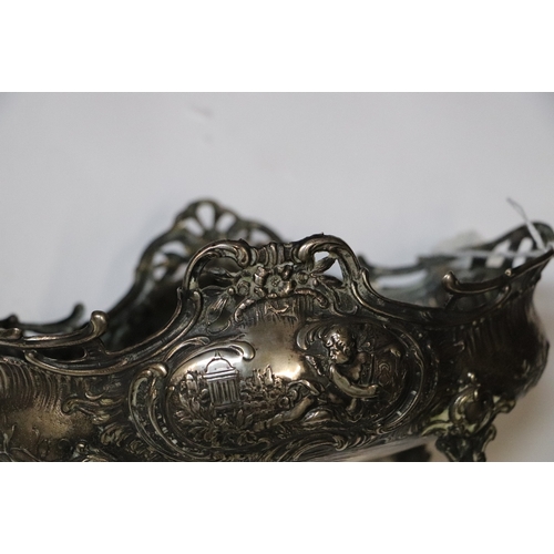 363 - A continental 800 grade silver basket decorated with classical figures, on four feet, 22cms wide, 33... 