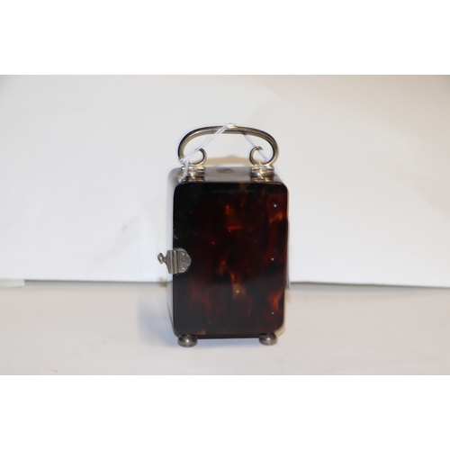 303 - A silver mounted tortoiseshell carriage time piece on bun feet with scroll handle, London 1920, 9cms... 