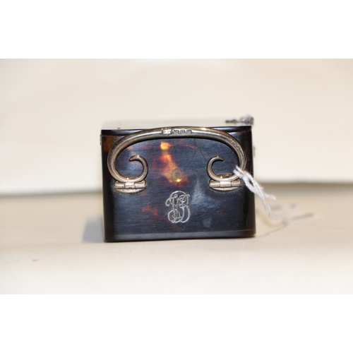 303 - A silver mounted tortoiseshell carriage time piece on bun feet with scroll handle, London 1920, 9cms... 