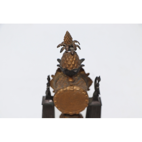 295 - A 19th century French Empire gilt bronze mantle clock with pineapple finial, the white porcelain dia... 