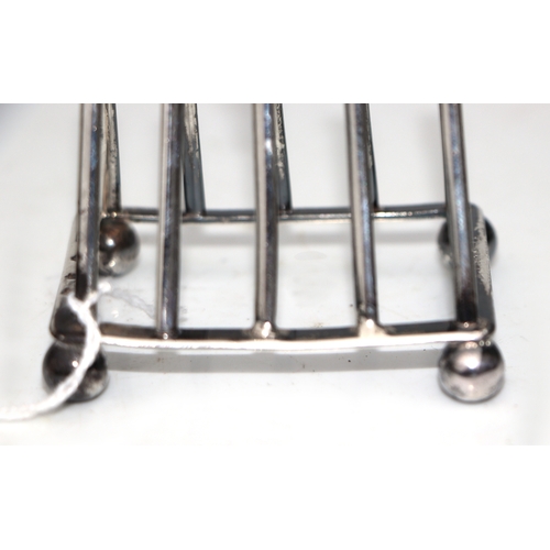 316 - An Edwardian Scottish silver four-division toast rack in the manner of Christopher Dresser, Edinburg... 