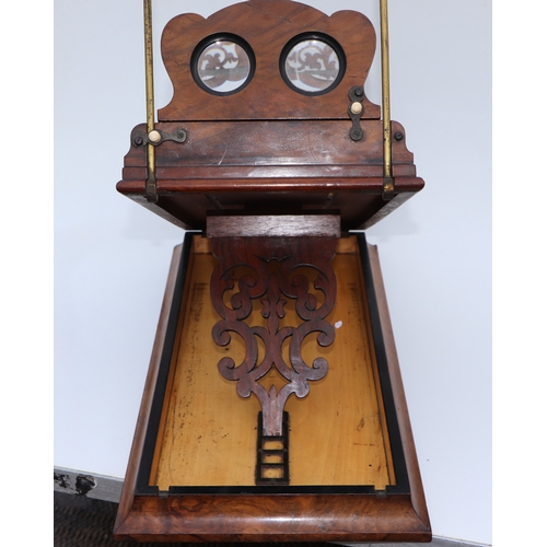 283 - A Victorian figured walnut stereoscopic table top card viewer, 61cms long.