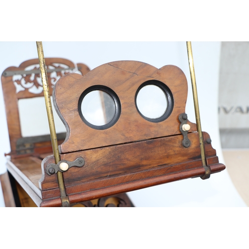 283 - A Victorian figured walnut stereoscopic table top card viewer, 61cms long.