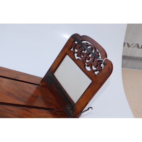 283 - A Victorian figured walnut stereoscopic table top card viewer, 61cms long.