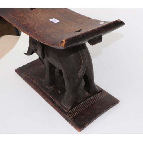 132 - African / Tribal Art.  An Ashanti hardwood stool on elephant support, 50cms wide.