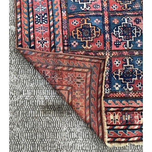 165 - A West Turkmenistan Tekke rug with a field of aina kochak guls, 164 by 244cms.