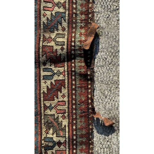 170 - A Persian hand knotted runner, the central medallions on a blue ground within a multi border, 419 by... 