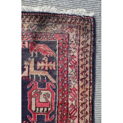 188 - A Persian Azari hand knotted woollen runner with stylised animals and bird motifs on a beige ground,... 