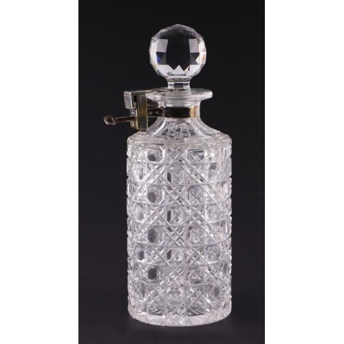 293 - A Betjemann's Patent glass hobnail cut lockable decanter with key, 25cms high.