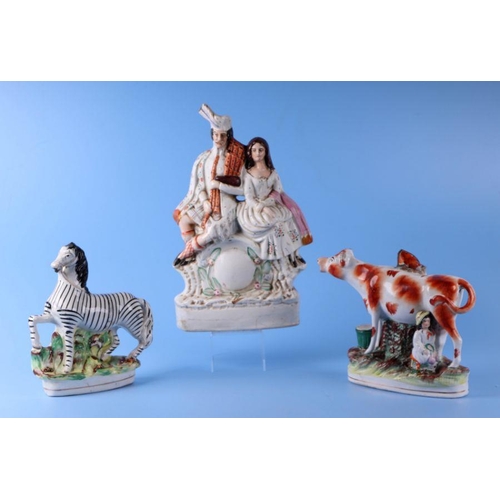 350 - A group of 19th century Staffordshire figures to include Napoleon and a zebra.