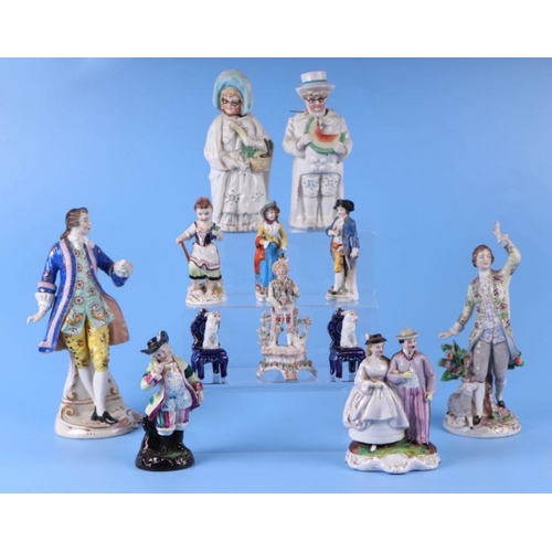 357 - A quantity of continental porcelain and pottery figures to include two nodding figures, the largest ... 