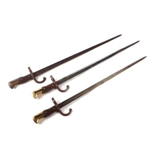 49 - Three 19th century French Gras bayonets, each with 52cms steel blades (3).