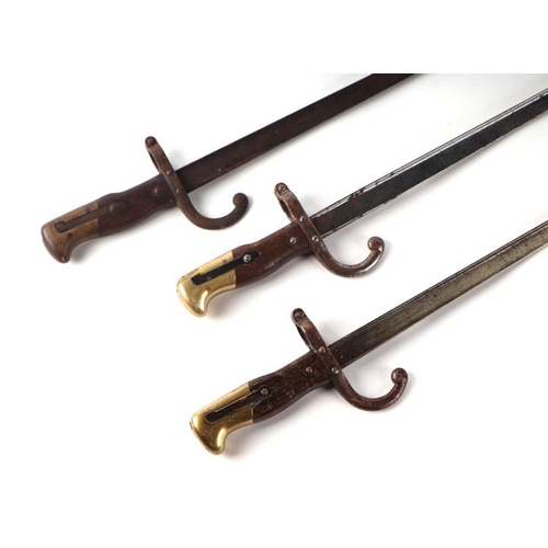 49 - Three 19th century French Gras bayonets, each with 52cms steel blades (3).