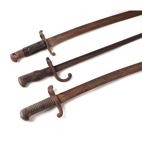 50 - A 19th century French bayonet with 52cms steel blade; together with two other bayonets (3).