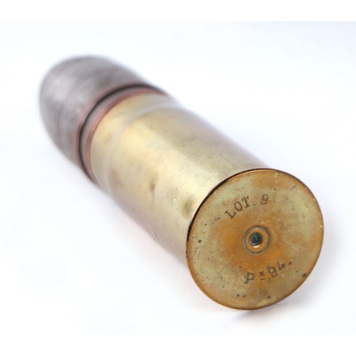 75 - A complete inert WW1 artillery shell and brass casing in two parts. Date stamp to the head for 1. 17... 