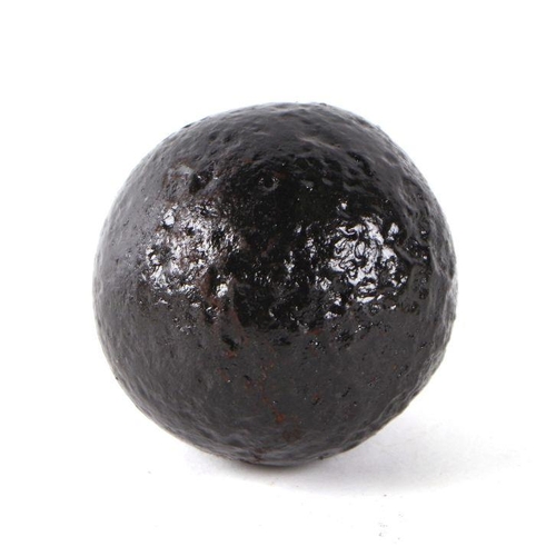 79 - A roundshot iron cannon ball. Approximate diameter of 6.5cms (2.5ins) on a turned oak mount