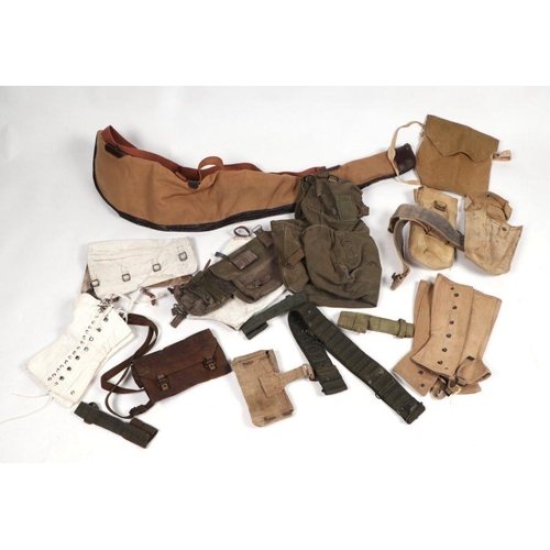 96 - A quantity of assorted military webbing items to include haversacks, kit bags and other similar item... 