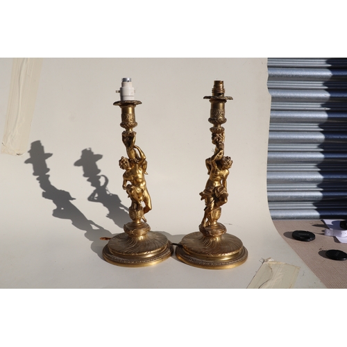 135 - A pair of gilt bronze figural table lamps, the columns in the form of neo-classical figures, each 41... 