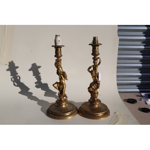 135 - A pair of gilt bronze figural table lamps, the columns in the form of neo-classical figures, each 41... 