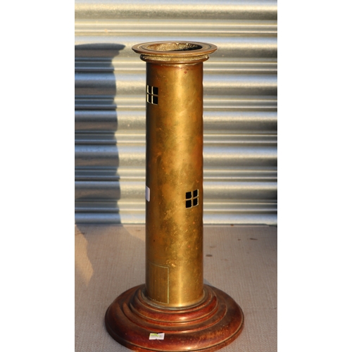 99 - A trench art WWI brass artillery shell converted to a table lamp in the form of a lighthouse, on a t... 