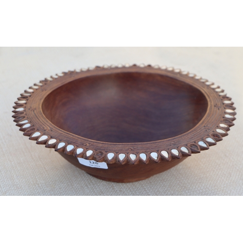 126 - A carved wooden platter, 32cms wide; together with others similar (5).