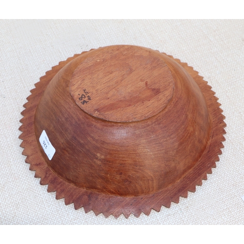 126 - A carved wooden platter, 32cms wide; together with others similar (5).