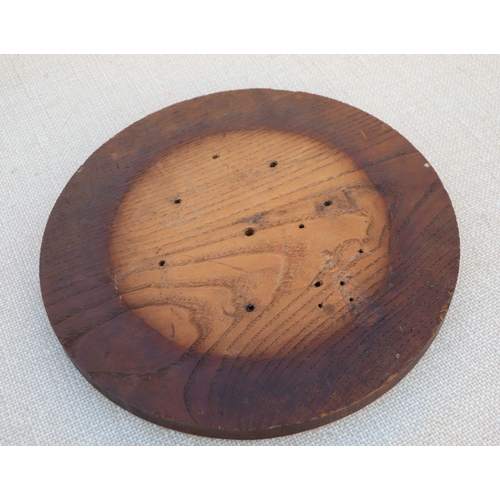 126 - A carved wooden platter, 32cms wide; together with others similar (5).