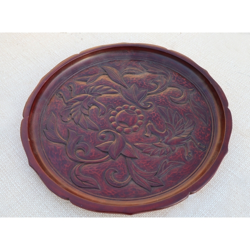 126 - A carved wooden platter, 32cms wide; together with others similar (5).