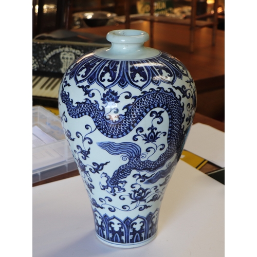 734 - A large Chinese blue & white Meiping vase decorated with a dragon amongst scrolling foliage, six... 