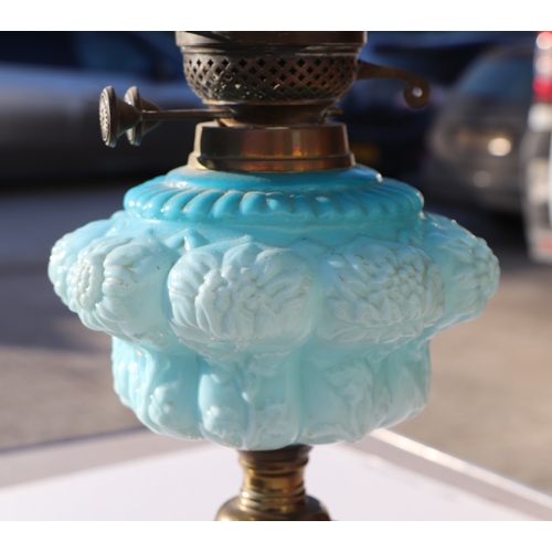 151 - Two Victorian oil lamps; together with a copper oil lamp on a mahogany stand (all a/f) (3).